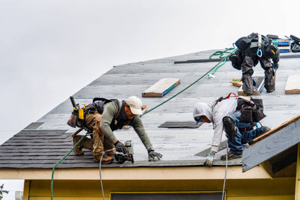 Professional Gutter Installation technician working in Acton, MA